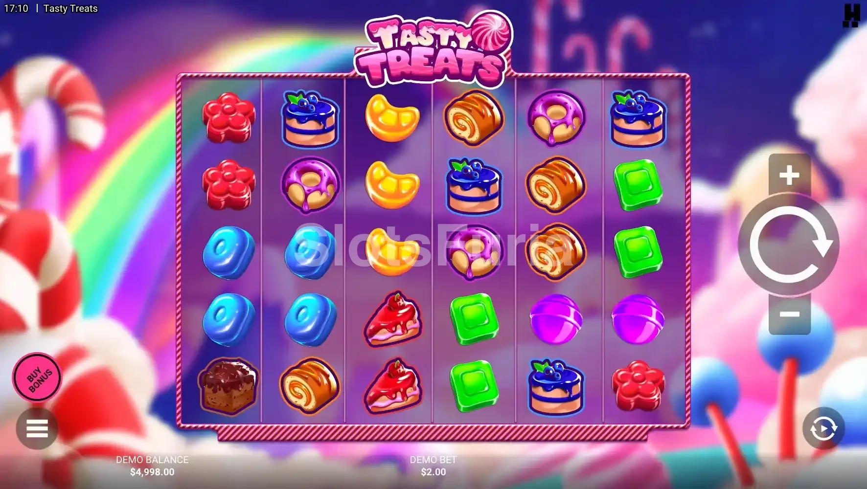 Pantalla principal del juego Tasty Treats con el tablero lleno de caramelos y símbolos dulces